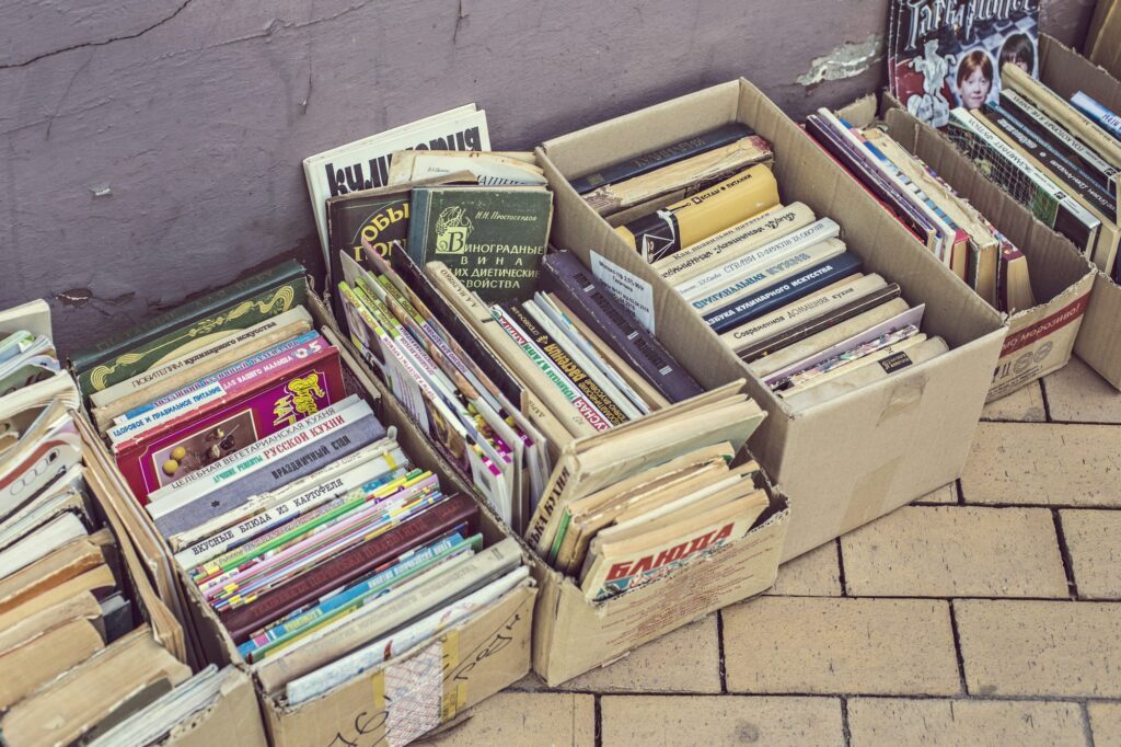 Cardboard boxes filled with old records ready to sell
