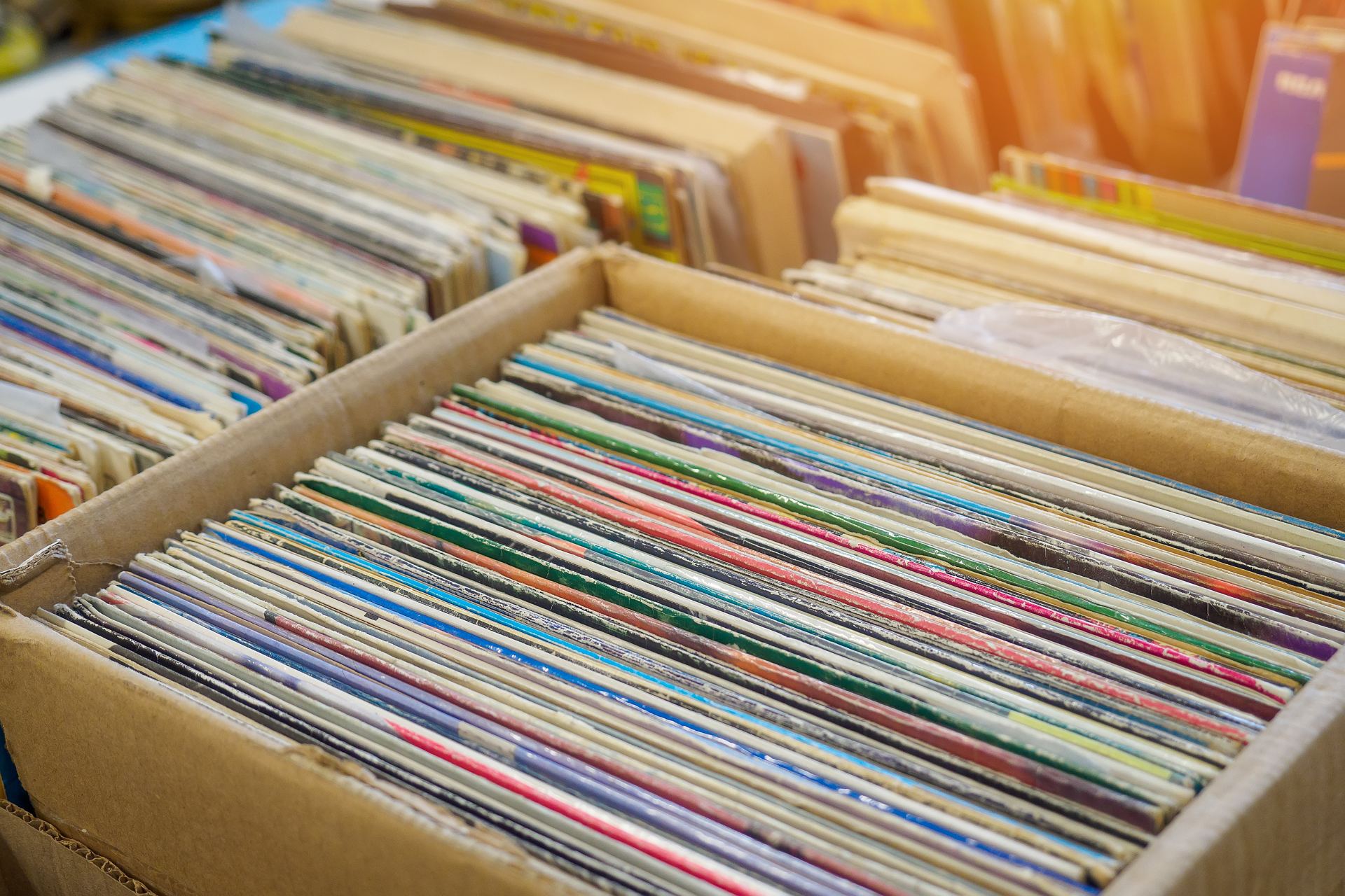Cardboard box filled with an old vinyl record collection